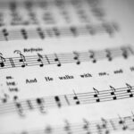 featuring musical notes and lyrics in focus.